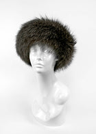 Fur hat on a mannequin head against a white background